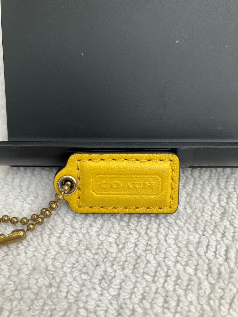 Coach small 1” bright yellow hang tag with stitching